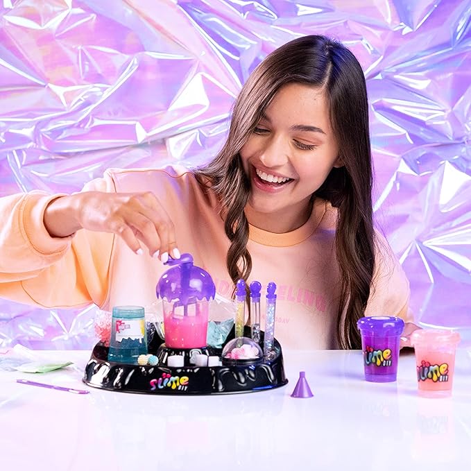 So Slime DIY Sensory Factory; Makes 10 Slimes; No Glue; No Mess; Sensory Mix’ins to Create ASMR Feels; Just Add Water and Turn The Crank; Slime Storage Containers Included